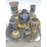 Eight pieces of Poole pottery including six vases,