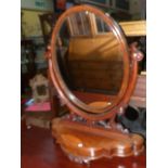 Victorian mahogany oval toilet mirror on shaped front base