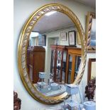 Large gilt-framed oval mirror,