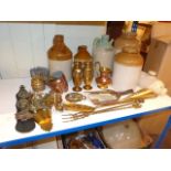 Six stone bottles, copper jelly moulds, horse brasses, pair brass vases,