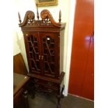 Chippendale style astragal glazed cabinet on three drawer stand