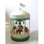 Vintage tinplate clockwork musical carousel merry-go-round,
