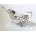 Silver sauce boat, Barker Bros Ltd, Birmingham 1937; and a sterling silver sauce ladle (2) Gross 11.