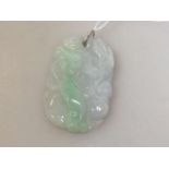 Carved jadeite pendant plaque, 42 grams, 7cm by 4.