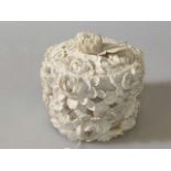 Japanese ivory box, early 20th Century, carved in relief with flowerheads,