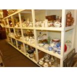 Full shelf of tea ware, jugs, Worcester tureens, brass coal helmet, ginger jars,