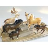Five Beswick deer and horses and doulton horse