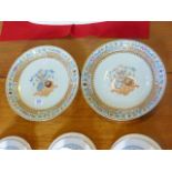 Pair of armorial plates in Chinese Export style,