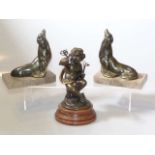 Bronze of a cherub with hinged top and a pair of seal-form bookends in Art Deco style (3)