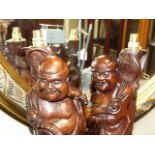 Pair of Chinese carved wooden figural table lamps