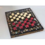 19th Century stained ivory draughts set in mother of pearl and lacquer box