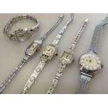 Two white metal cocktail watches set with diamonds and three further cocktail watches (5)