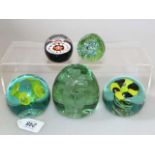 Victorian green glass flower dump and four paperweights