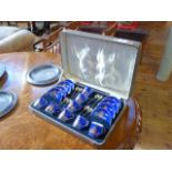 Cased Crescent china sixteen piece coffee set with chinoiserie decoration and silver spoons