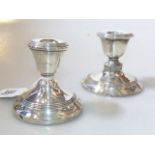 Two silver dwarf candlesticks (weighted)