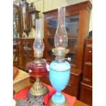 Victorian opaque blue glass oil lamp and ruby reservoir oil lamp (2)