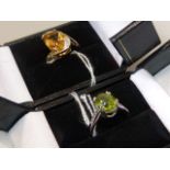 Peridot and silver ring, size N; and a citrine and diamond ring, hallmarked 9ct gold,