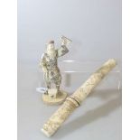 Japanese carved bone figure and a Japanese tanto with carved ivory handle and sheath (2)