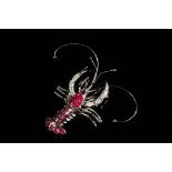 BROOCH - One 18K White Gold, Diamond and Ruby Lobster Form brooch with articulated body. Rubies