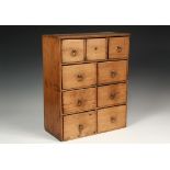 COLONIAL SPICE CABINET - 18th c. Pumpkin Pine Cabinet with three over three ranks of two drawers,