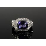 LADY'S RING - 18K White Gold Ring, Tanzanite with Diamond surround. Size 11 1/4. Fine condition.