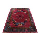 CHINESE CARPET - 8'9" x 11'9" - First quarter 20th c, circular floral medallion with inscription, in