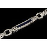 BRACELET - One 14K White Gold, Sapphire and Diamond Bracelet, set with (21) channel set blue