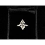 LADY'S RING - Platinum Contemporary Design Ring, set with one marquise cut diamond measuring 14.45 x