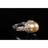 LADY'S RING - One 18K White Gold, Golden Pearl, Diamond and Orange Sapphire Ring, marked Mauboussin,