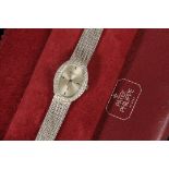 LADY'S WRISTWATCH - 18K White Gold and Diamond Oval Head Patek Philippe Wristwatch in original