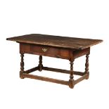 18TH C TAVERN TABLE WITH DRAWER - Long Table with three-plank top having breadboard ends, deep skirt
