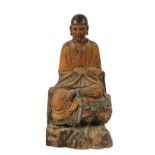 CHINESE WOODEN SCULPTURE - Seated Lohan in Hankazou Half Lotus, polychromed softwood, late Yuan to