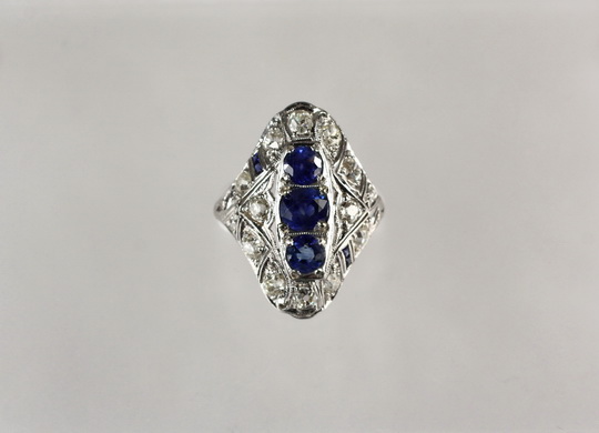 LADY'S RING - Edwardian Platinum, Sapphire and Diamond Dinner Ring; size 6 1/2.