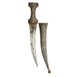 **A PERSIAN DAGGER (JAMBIYA) with curved double-edged fullered blade formed with a medial ridge,