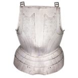 A GERMAN BREASTPLATE WITH EMBOSSED DECORATION IN THE 'BLACK AND WHITE' FASHION, CIRCA 1570 formed of