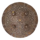 **AN UNUSUAL INDIAN CIRCULAR IRON SHIELD (DHAL) OF SIEGE WEIGHT, LATE 18TH/EARLY 19TH CENTURY of