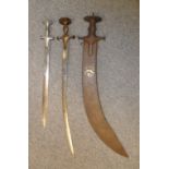 AN INDIAN EXECUTIONER'S SWORD (TEGHA) AND TWO INDIAN SWORDS (TALWAR), 18TH/19TH CENTURIES the