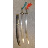 **A PAIR OF CHINESE SWORDS (SHUANGNIUWEIDAO), EARLY 20TH CENTURY each with curved blade widening