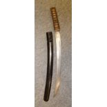 A JAPANESE SHORTSWORD (WAKIZASHI) with curved single-edged blade formed with a pair of short grooves