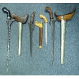 FOUR SOUTHEAST ASIAN EDGED WEAPONS, LATE 19TH/20TH CENTURY comprising a Javanese keris with wavy