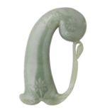 AN INDIAN JADE HILT FOR A DAGGER, 19TH CENTURY of carved green jade, comprising pistol-shaped grip