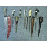 SIX MIDDLE EASTERN DAGGERS, 19TH CENTURY comprising an Afghan pesh-kabz with brass ferrule and