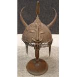 A PERSIAN HELMET (KULAH KHUD), QAJAR, 19TH CENTURY with hemispherical skull embossed with a demon