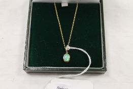 An 18ct gold opal pendant on chain. CONDITION REPORT: Good condition.