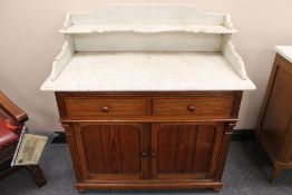 A Victorian marble topped pitch pine wash stand, width 111 cm. CONDITION REPORT: Good condition.