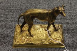 A gilt bronze figure of a greyhound, on naturalistic plinth, width 14.5 cm. CONDITION REPORT: Good