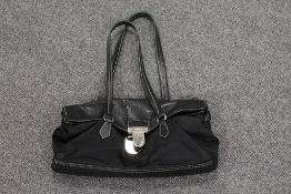 A Prada black leather and cloth shoulder bag. CONDITION REPORT: Good condition.
