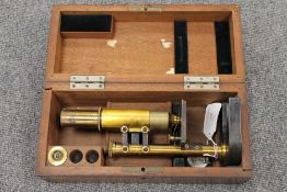 A lacquered brass Leitz Wetzlar field microscope, boxed. CONDITION REPORT: Time aged condnition,