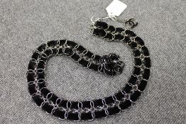 A Chanel black suede and white metal belt, length 78 cm. CONDITION REPORT: Good condition.