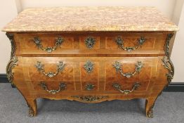 A French ormolu mounted three drawer bombe commode, with rouge marble top, width 124 cm. CONDITION